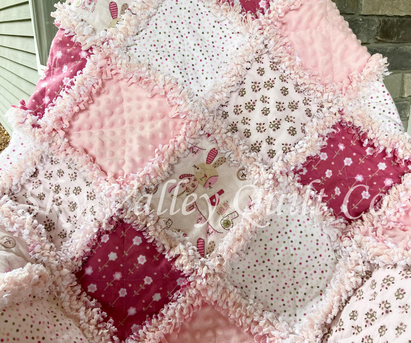 Finished rag quilt - rag bunnies in light pink and cranberry flannels
