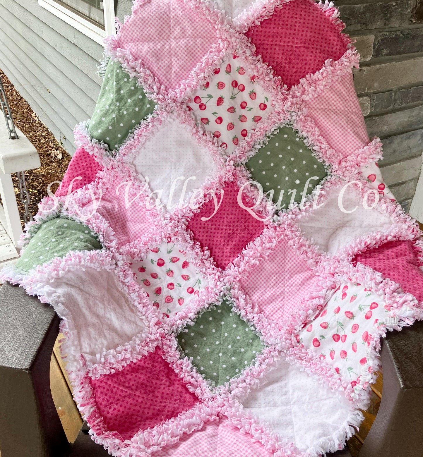 Finished rag quilt - strawberries in pinks and sage green flannels