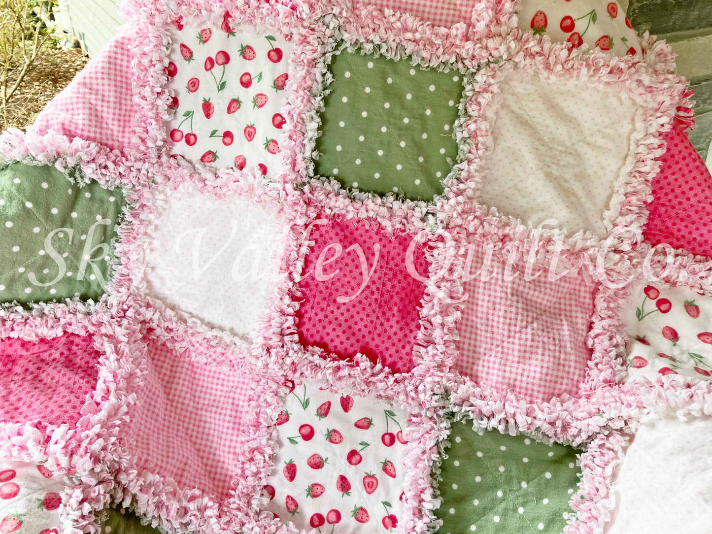Finished rag quilt - strawberries in pinks and sage green flannels