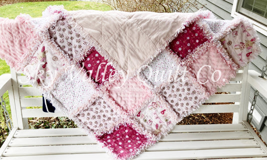 Finished rag quilt - rag bunnies in light pink and cranberry flannels