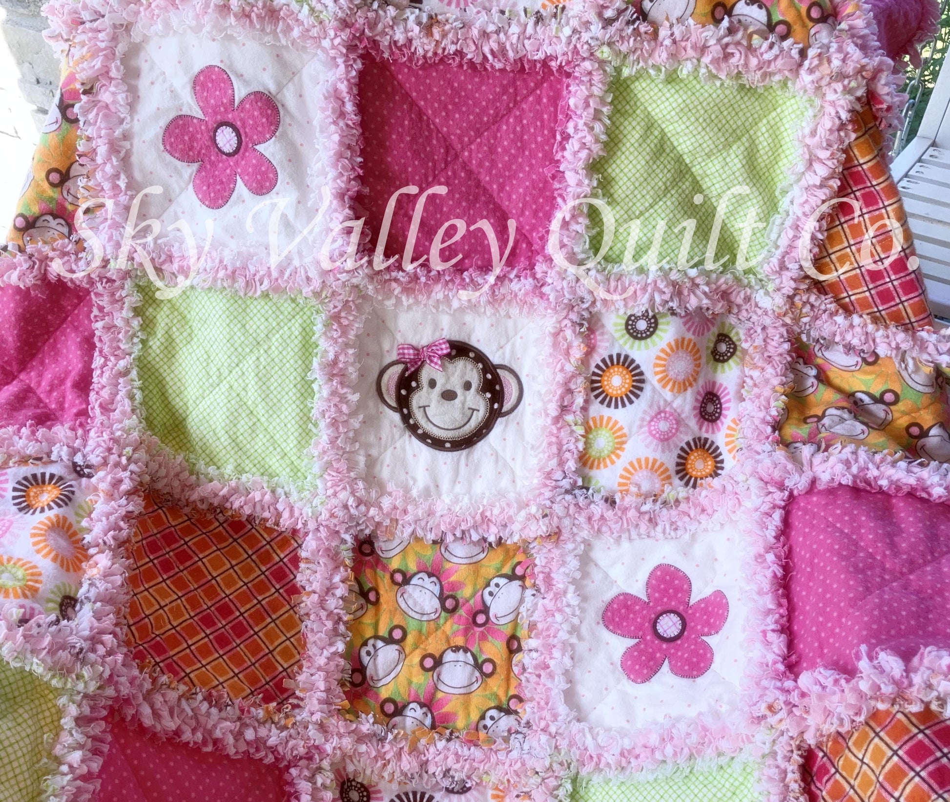 Finished and ready to ship rag quilt -pink and green monkey applique quilt