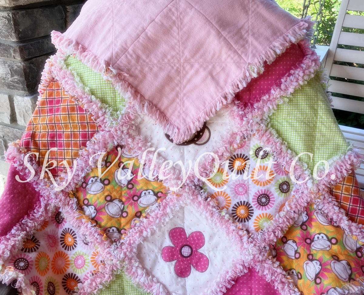 Finished and ready to ship rag quilt -pink and green monkey applique quilt